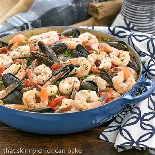 Julia Child's Paella a l'Americaine in a blue paella dish.