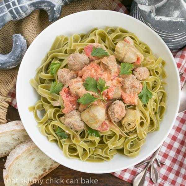 Pasta with Sausage and Cream Pasta swirled with a creamy sauce, artichoke hearts, tomatoes and Italian sausage. #ad #JoinTheTable