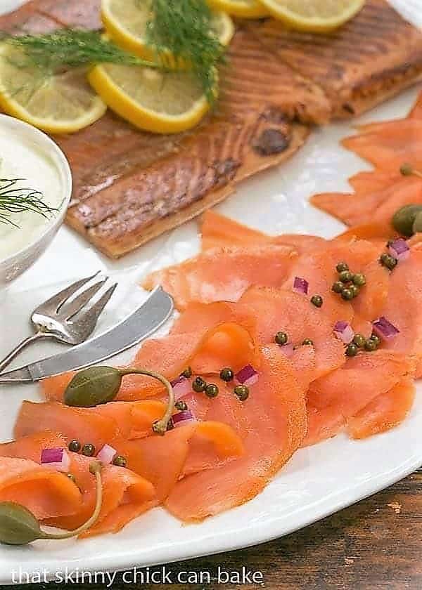 Close view of Smoked Salmon Appetizer on a white ceramic tray.