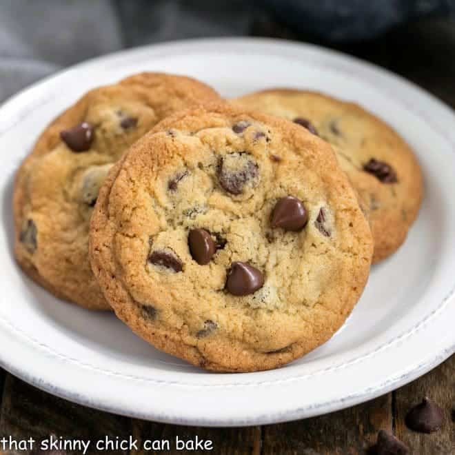 Thin and Chewy Chocolate Chip Cookies on a round white plate