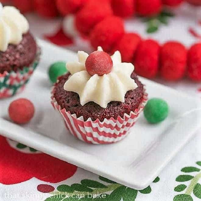 Mini Red Velvet Cupcakes on a white tray decked out for Christmas