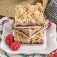 Raspberry Crumb Bars Simple, but delectable bars with a layer of raspberry jam and a thick crumb topping!