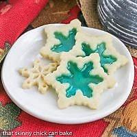 Stained glass cookies on a small, round white plate