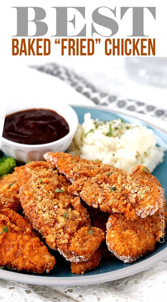 Fried chicken pieces piled on a dinner plate