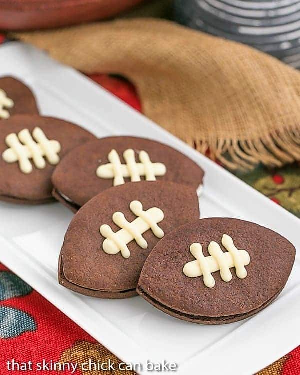 White platter with a number of Chocolate Football Cookies 