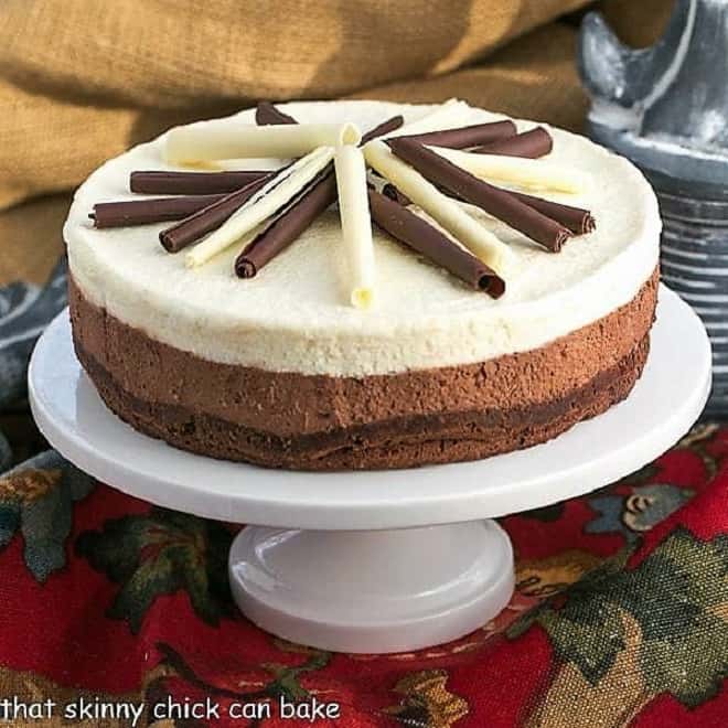 Layered Mousse Cake on a white ceramic cake plate.