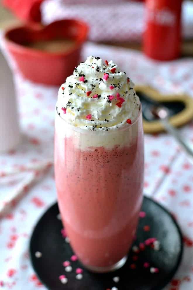 Red Velvet Mocha Milkshake topped with whipped cream and sprinkles