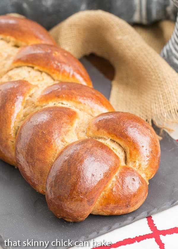 Whole Wheat Challah loaf on a slate tray