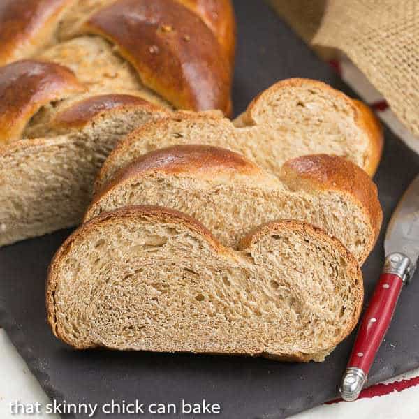 Slices of Whole Wheat Challah on a slate tray