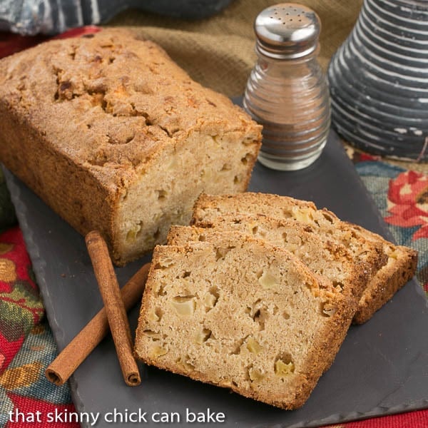 Apple Bread loaf and slices on a slate tray.
