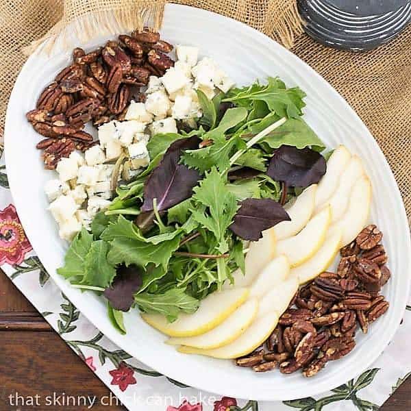 Blue Cheese and Pear Salad on a white, oval ceramic plate