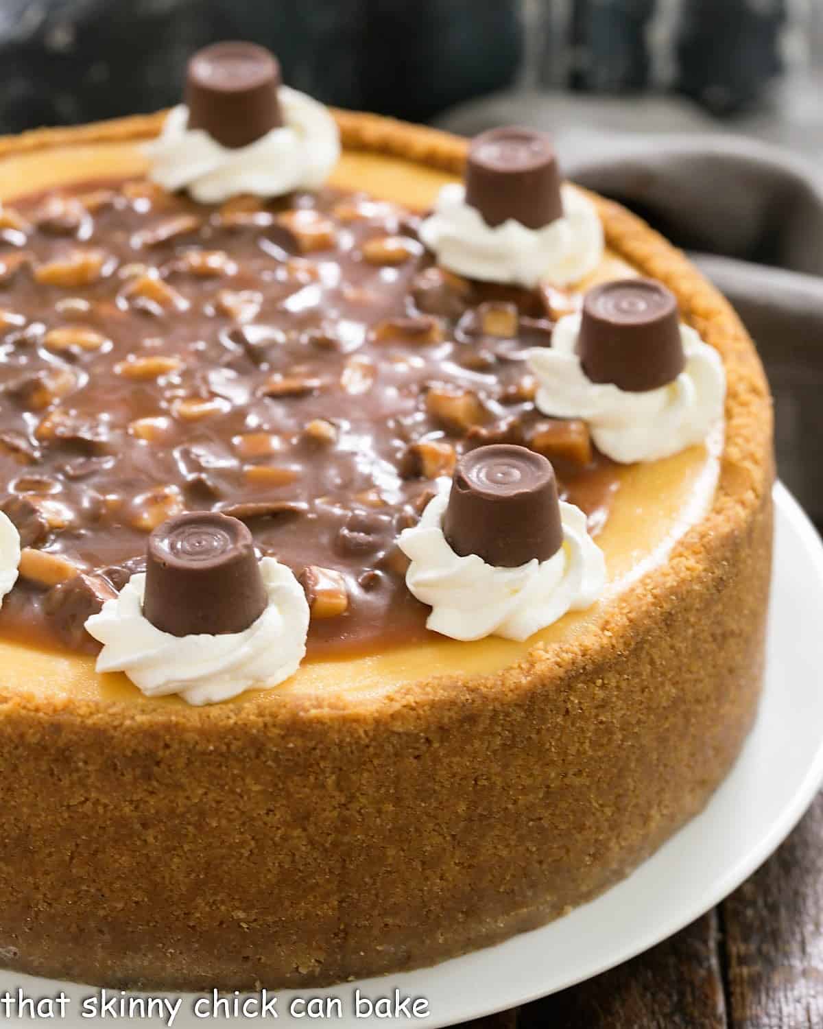 Close view of caramel cheesecake on a white serving plate.