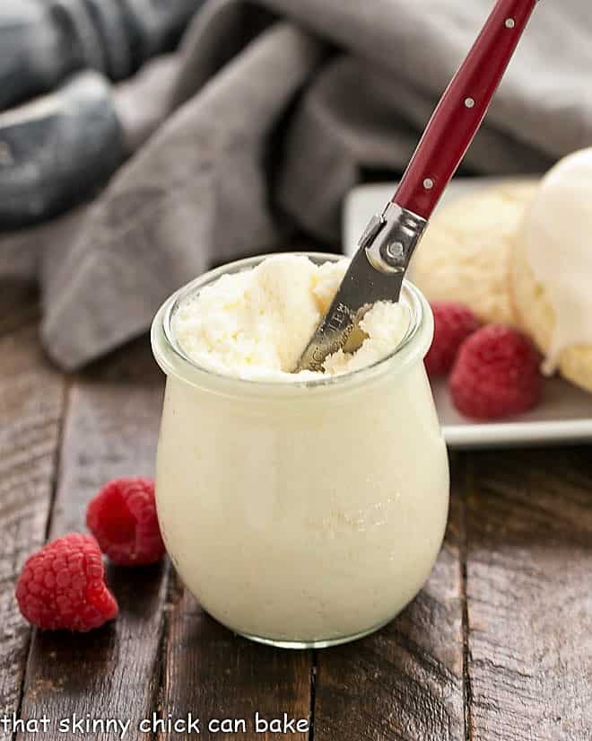 Instant Pot Clotted Cream Recipe in a Weck jar with a red handled knife.