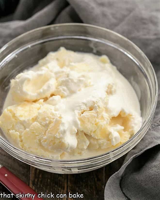 A bowl of homemade clotted cream scooped directly from the Instant Pot.