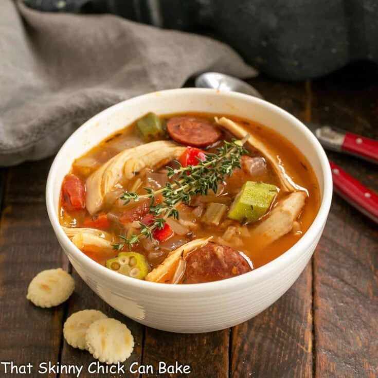 White bowl filled with Jambalaya Soup.