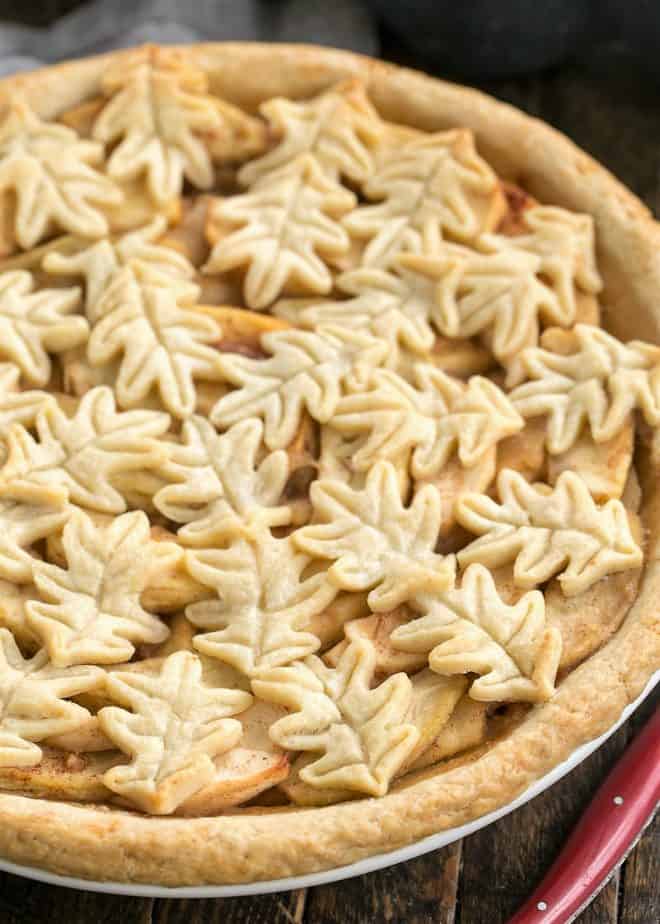 Close up of top crust of leaf topped apple pie.