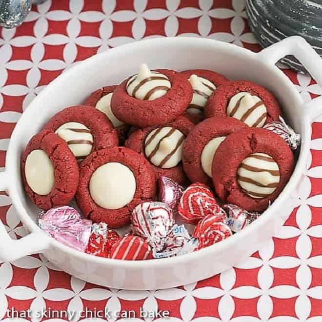 Red velvet thumbprint cookies in a white terrine with Valentine's Day hugs