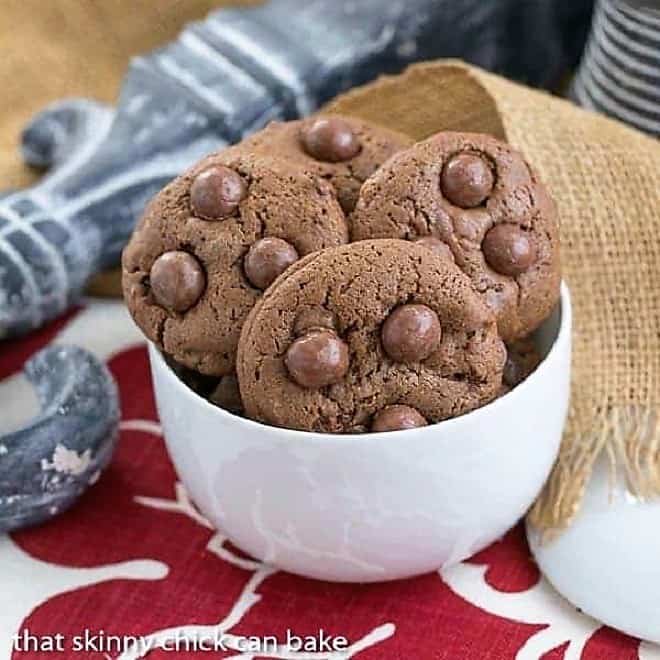 Whopper Cookies in a white bowl sitting on a red and white napkin.