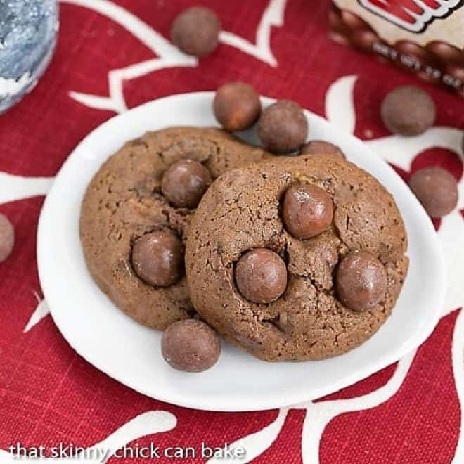 Overhead view of Chocolate malt cookies on an oval white plate.