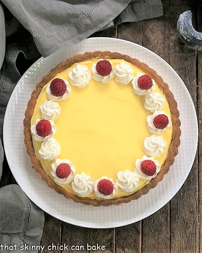 Overhead view of Creamy Lemon Tart on a white plate.