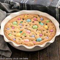 Easter candy cookie cake in a white ceramic pie plate