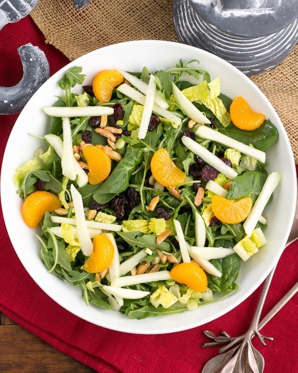 Holiday Lettuce Salad in a serving bowl on a red napkin