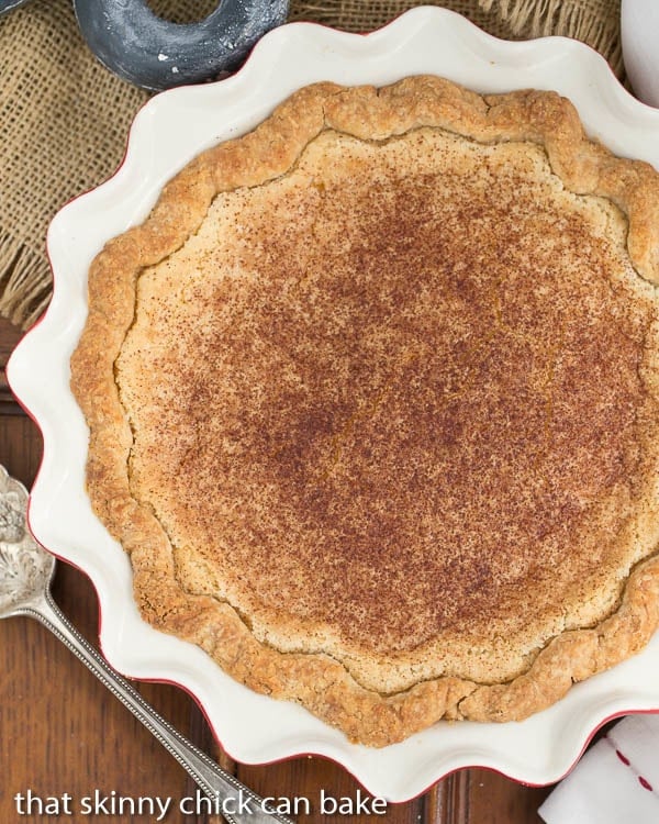 Sugar Cream Pie in a red and white ceramic pie plate from above.