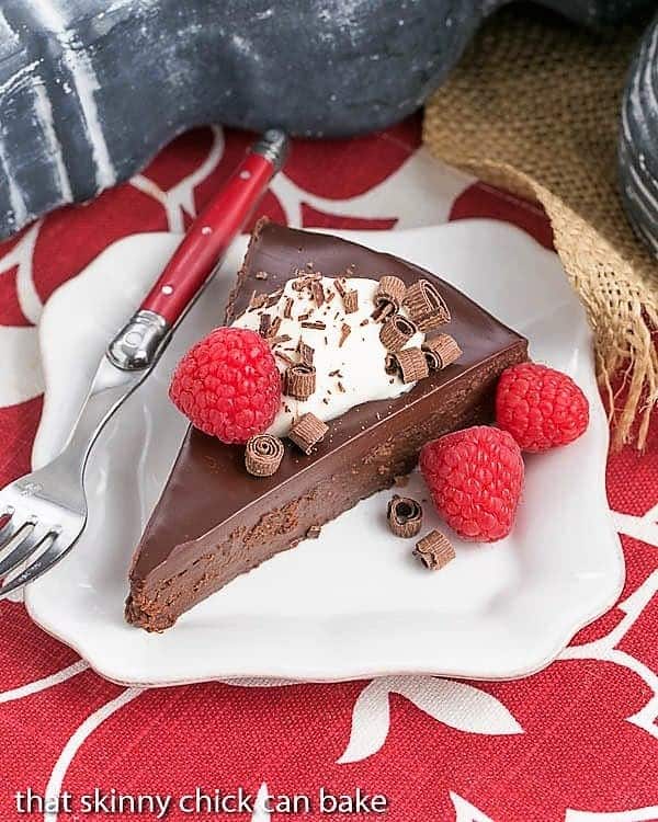 Overhead shot of a slice of La Bete Noire on a white plate.