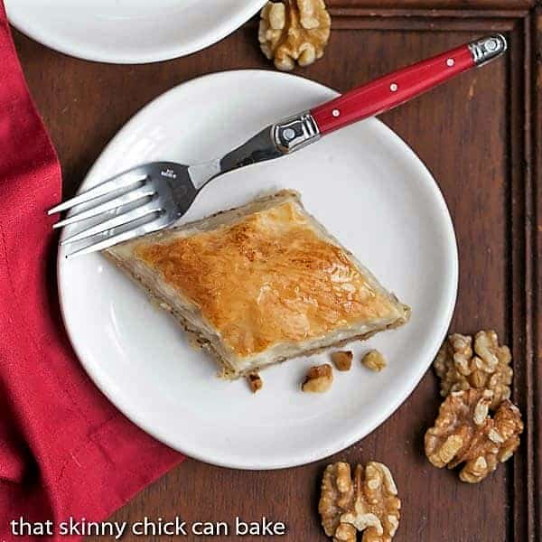 Overhead view of a slice of Classic Greek Baklava slice on a white plate.