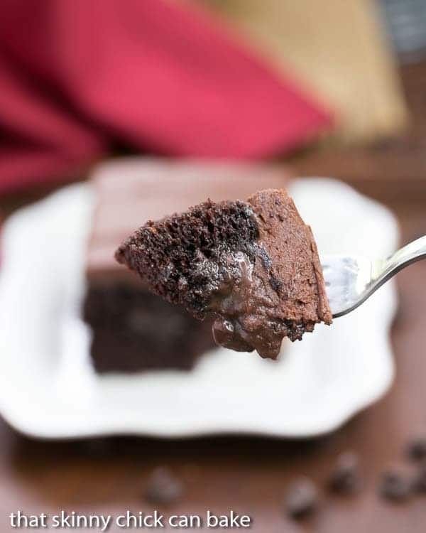 A bite of Triple Chocolate Poke Cake on a fork