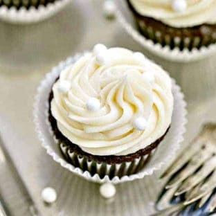 Vanilla Buttercream Topped Cocoa Cupcakes on a silver tray