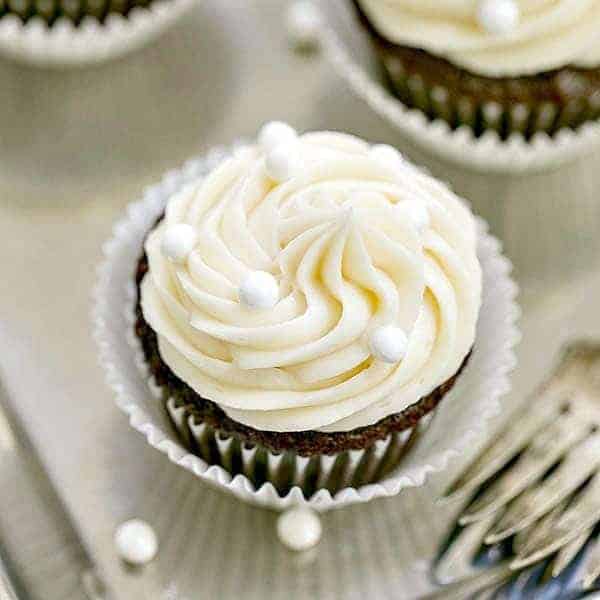 Vanilla Buttercream Topped Cocoa Cupcakes | Moist, scrumptious chocolate cupcakes topped with a mound of vanilla buttercream