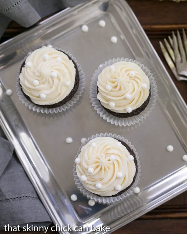 Overhead view of Vanilla Buttercream Topped Cocoa Cupcakes on a silver tray