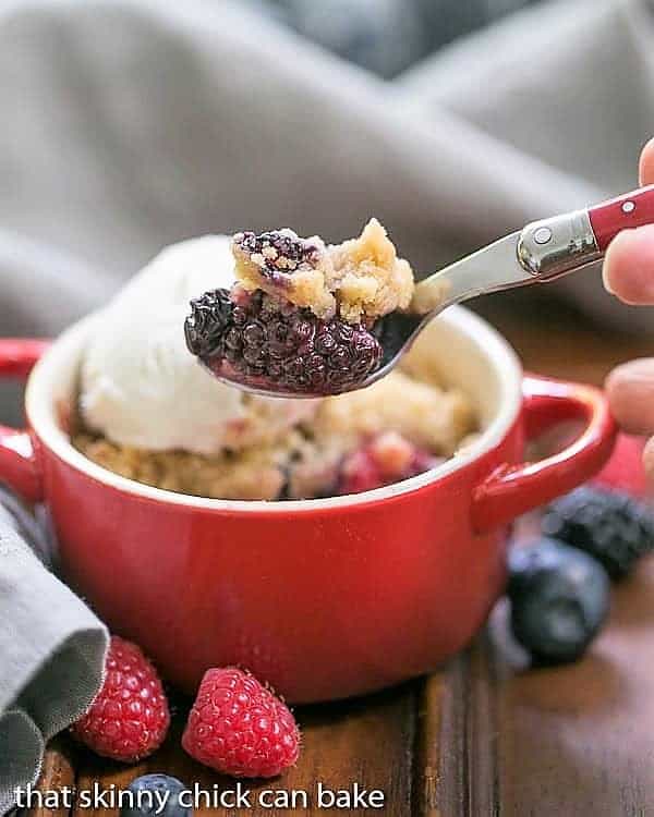 A spoon with a smalll scoop removed from an Individual Berry Crisp 