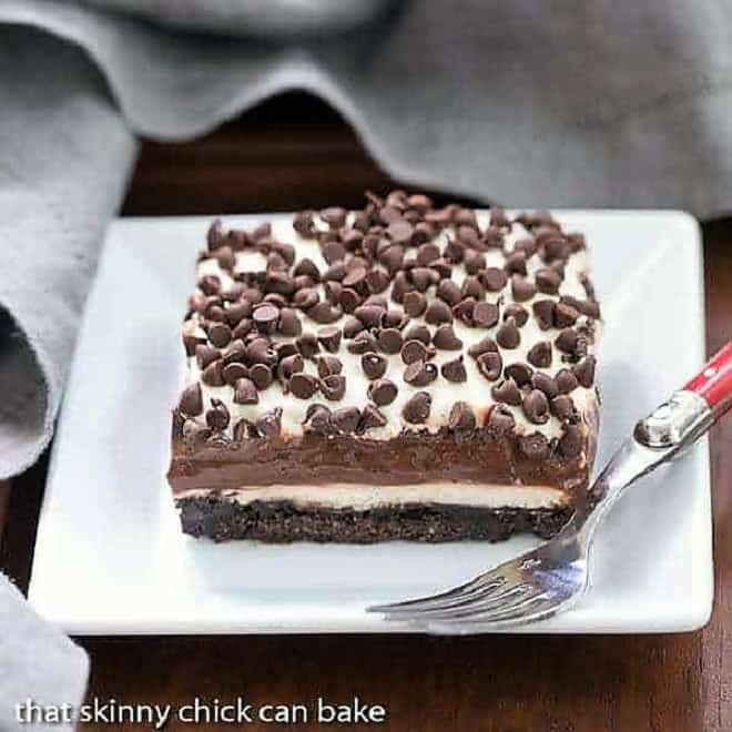 Chocolate Lasagna slice on a square white plate