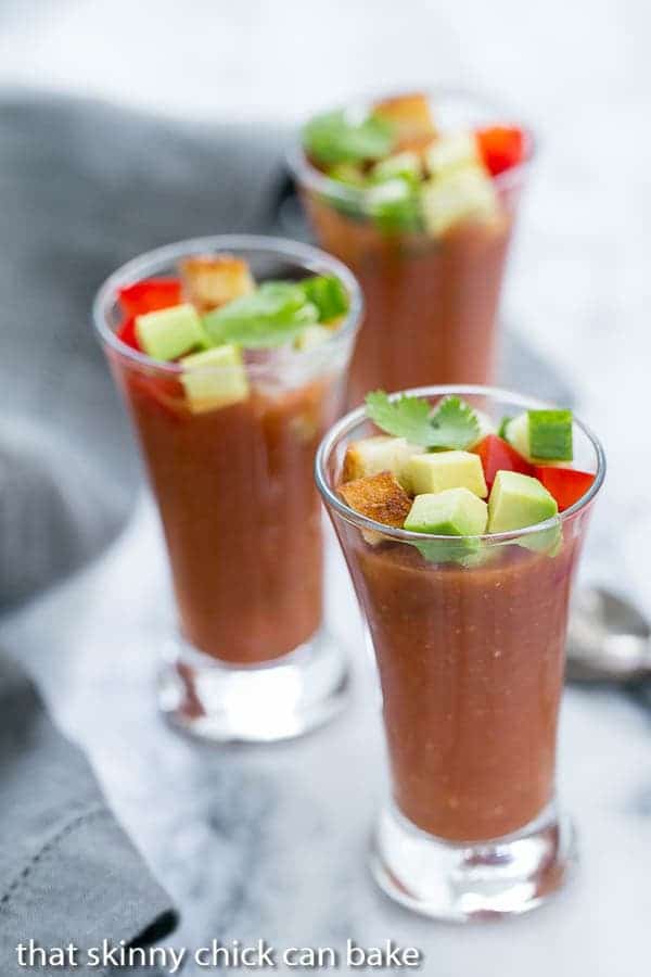 Gazpacho Shooters sitting on a marble tray.