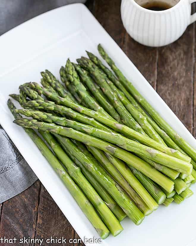 Roasted Asparagus with Balsamic Brown Butter on a white platter.