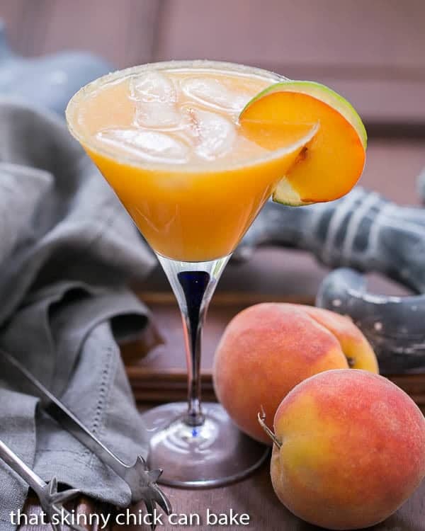 Fresh Peach Margaritas in a martini glass.