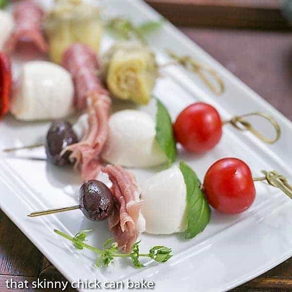 Close up of Antipasto Skewers on a white tray.