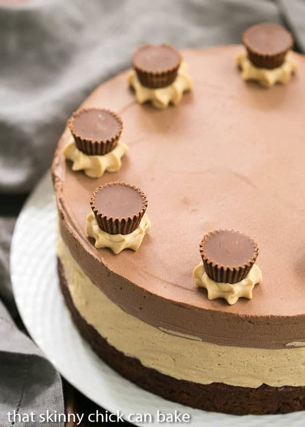 Peanut Butter Chocolate Mousse Cake on a basket weave serving plate.