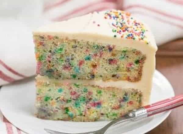 Confetti Cake | A moist vanilla cake doused in vanilla syrup and iced with a delectable vanilla malt frosting!
