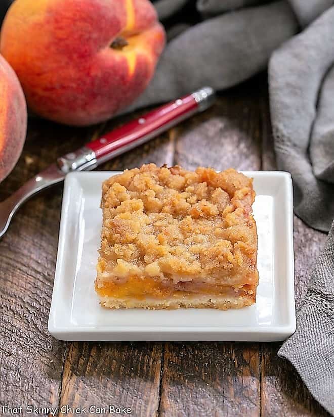 A fresh peach bar on a square white plate