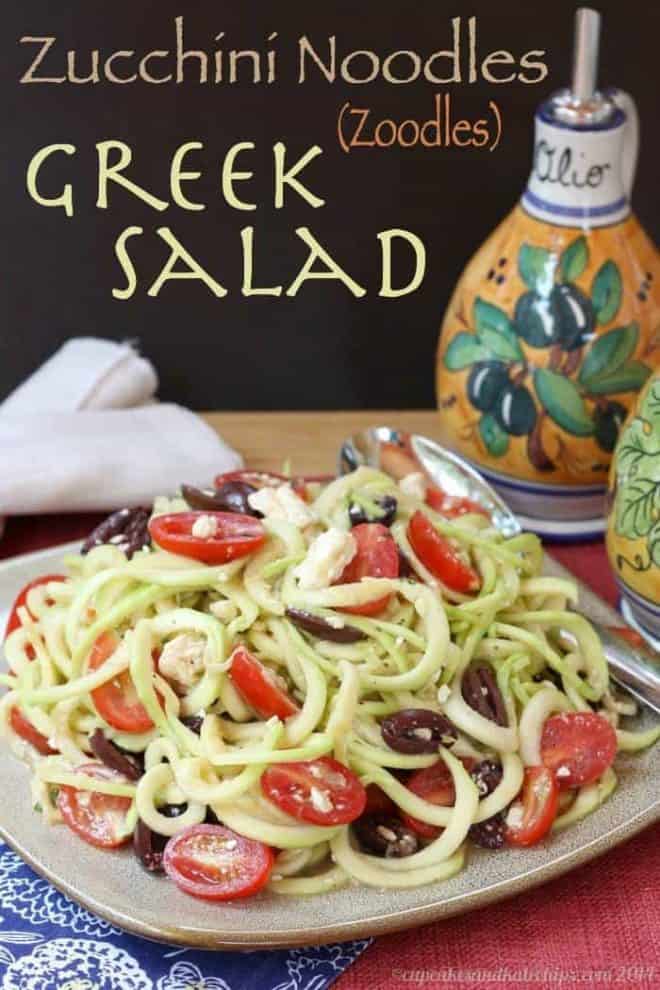 A Greek salad with zucchini noodles on a plate