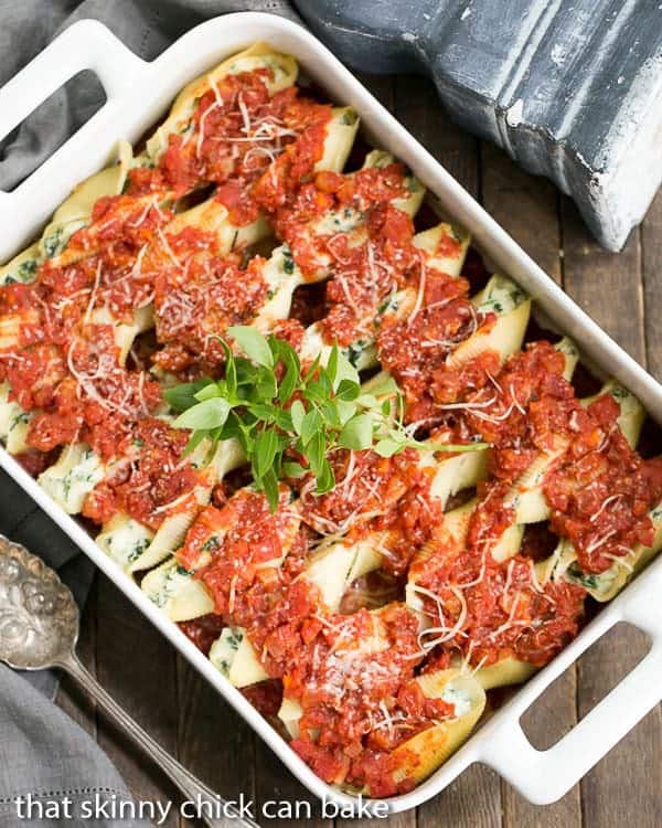 Spinach Stuffed Pasta Shells in a white ceramic casserole dish.