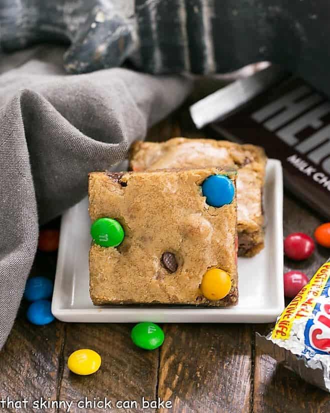 2 Candy Bar Blondies on a square white plate.