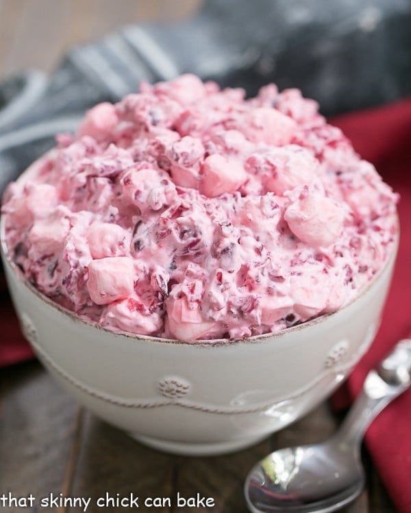 Cranberry Fluff Salad - A simple version of the classic Thanksgiving side dish! Cranberry Fluff Salad in a white bowl.