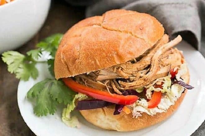 Honey Garlic Chicken Slider on a white luncheon plate with a cilantro garnish