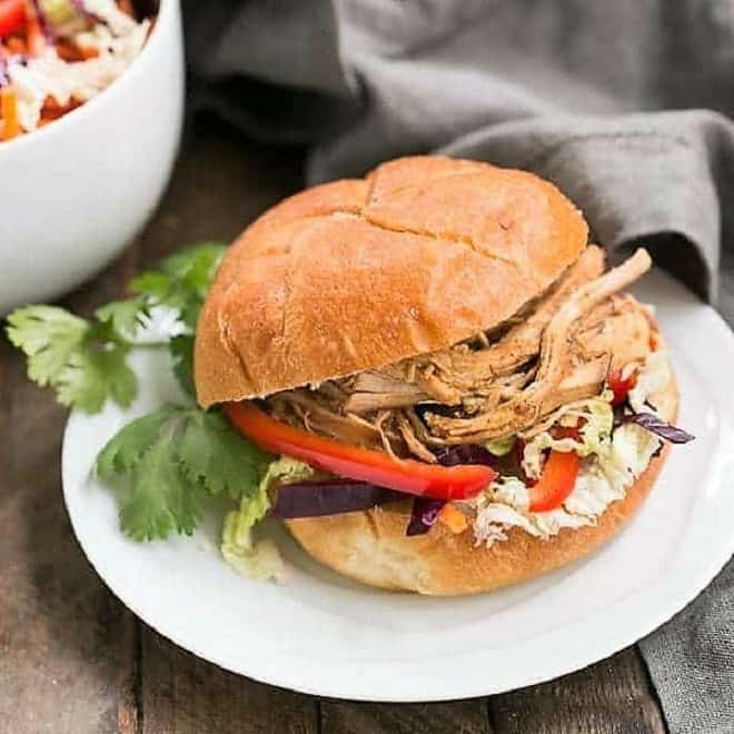 Honey Garlic Chicken Slider on a white luncheon plate with a cilantro garnish