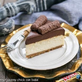 Twix cheesecake slice on a white plate
