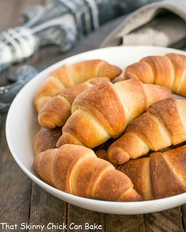 Buttery Homemade Crescent Rolls in a white serving bowl.